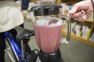 a blender with purple smoothie
