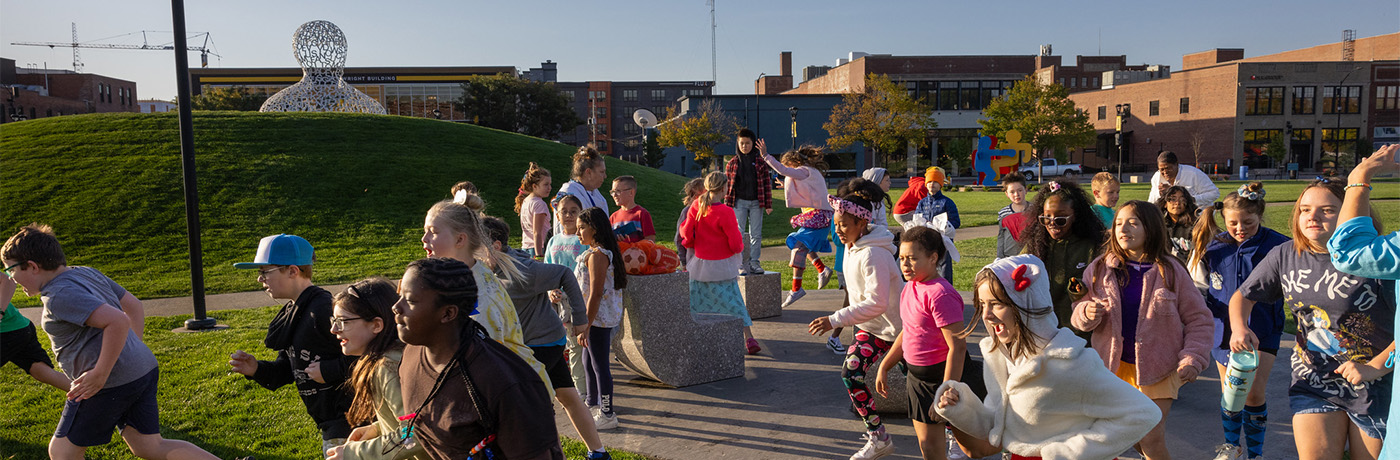 students walking and running in a park