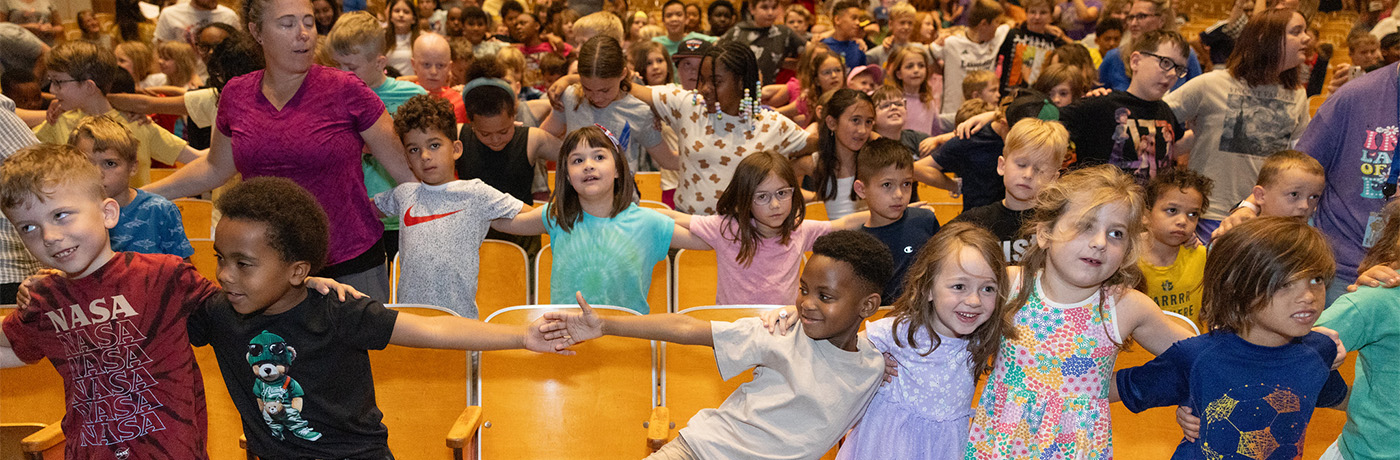 school signalong students holding hands